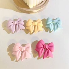 采用 ABS 材质的马卡龙蝴蝶结手机支架，防水，适用于智能手机的多功能支架，彩色哑光桌面支架