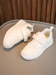 Ein Paar klassischer Unisex weißer Sneakers mit Klettverschluss Design, weiche Sohle, geeignet für Frühling und Herbst