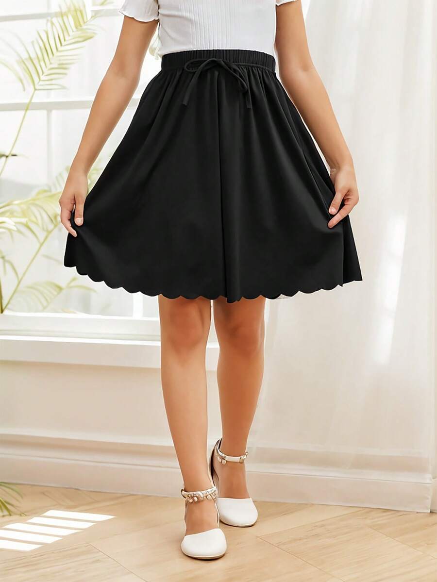 GORLYA Girls' Casual Versatile Ruffle Hem Elasticated Waist A-Line Midi Skirt, Suitable For Shopping, Evening Party, Back To School, Vacation - Black - View 1