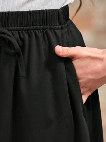 GORLYA Girls' Casual Versatile Ruffle Hem Elasticated Waist A-Line Midi Skirt, Suitable For Shopping, Evening Party, Back To School, Vacation - Black - View 7