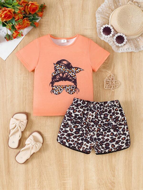 Conjunto de camiseta de manga corta con cuello redondo y estampado gráfico de personaje para niña joven, y pantalones cortos con cintura elástica y ribete de contraste con estampado de leopardo