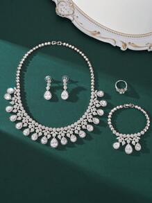 4 pièces/set bijoux de luxe à la mode avec zircone cubique AAA, parures avec pendentifs style goutte d'eau comprenant collier, bracelet, boucles d'oreilles, bague. Convient pour la décoration des fêtes et mariages des femmes. Cadeau parfait de la Saint-Valentin pour votre petite amie. Ensemble de bijoux haut de gamme.