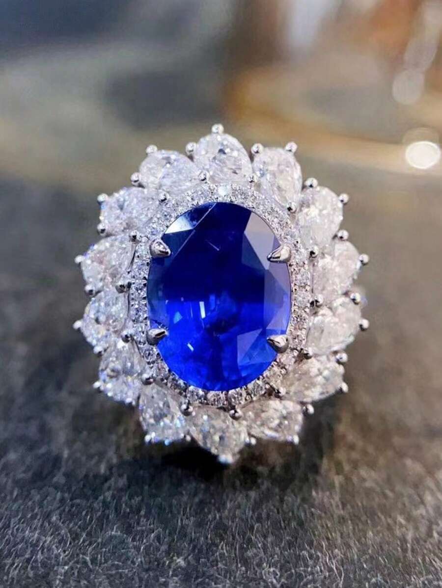 Phong cách thời trang Nhẫn Sapphire màu xanh lam thanh lịch bằng bạc 925, Thiết kế bốn ngạnh hình bầu dục, Khảm kim cương hình giọt nước sáng bóng. Thích hợp cho các quý cô dự tiệc tối, đám cưới sang trọng hoặc bất kỳ dịp nào khác. - Nhiều màu - Xem 1