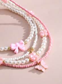Set de 4 collares con mariposas y flores de perlas y cuentas para niñas