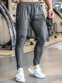 Pantalones de sudadera casuales y cómodos de verano para hombres con bolsillo con cremallera, cintura ajustable y detalles reflectantes, para entrenamiento