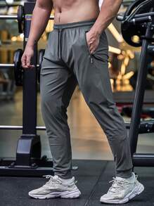 Pantalones de sudadera casuales y cómodos de verano para hombres con bolsillo con cremallera, cintura ajustable y detalles reflectantes, para entrenamiento