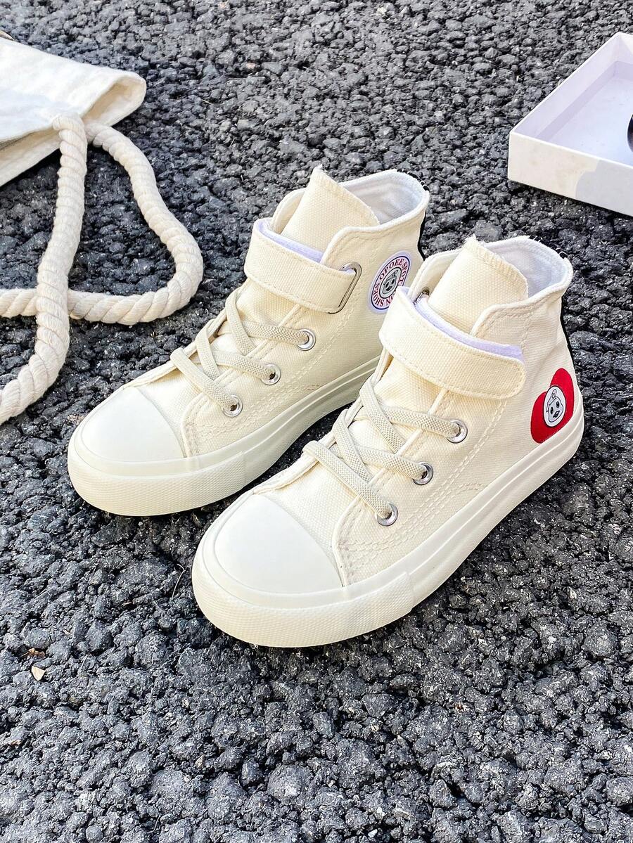 Zapatillas de lona OPOEE, zapatillas deportivas de media caña para niños, para primavera/otoño, estilo coreano, unisex, de moda con suela baja, zapatos deportivos casuales con cordones, zapatillas clásicas de caña alta, zapatos deportivos casuales todo a juego para patineta para niños - Blanco - Ver 1