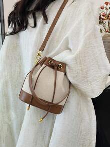 女士水桶包休闲草编单肩斜挎抽绳手提包