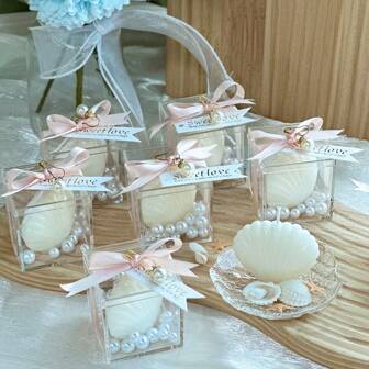 VICKYO 6-pack snäcksljuspresentset för gäster, 6-pack vita snäcksljusformade med akrylaskar och rosa bandetiketter, perfekt för babyshower, bröllop, brudgubbspresent och strandfestgåvor