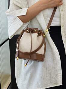 女士水桶包休闲草编单肩斜挎抽绳手提包