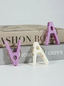 12 szt. wytrzymałych plastikowych klamerek do bielizny, 20 szt./zestaw, dwukolorowe, wiatroszczelne i antypoślizgowe, odpowiednie do prania, klipsy do moskitier - Wielokolorowe - Zobacz 9