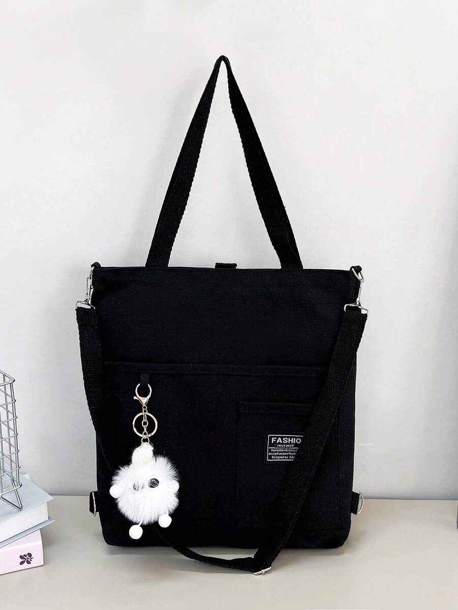 带有品牌徽标和吊坠的极简主义帆布手提包，学校包，返校背包，大容量，笔记本电脑隔层，轻巧，便携，经典休闲，适合少女女大学生，非常适合返校、大学、中学、高中、工作、商务、通勤、街头和日式风格女包，大号校园手提包，多个隔层，非常适合海滩、学校、工作和日常使用 - 黑色 - 查看 1