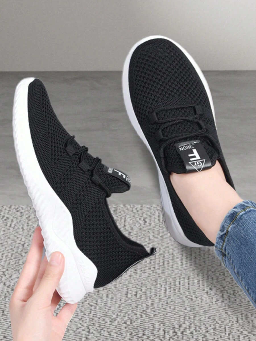Zapatillas de deporte de tela facial transpirable de color sólido para mujer, zapatos casuales de mujer casual con cordones de punta redonda, cómodos tenis planos antideslizantes, adecuados para deportes, tenis, fitness, ejercicio, ropa casual, uso diario. - Negro - Ver 1
