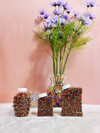 40,000 piezas/30,000 piezas/20,000 piezas/1,000 piezas de perlas de gelatina de hidrogel de colores, perlas de relleno de jarrón, perlas de agua, perlas hidropónicas para plantas. Estas perlas mágicas se expanden de tamaño cuando se exponen al agua, eliminando la necesidad de regar los jarrones con frecuencia después de su uso. Son adecuadas para rellenar velas y jarrones, cultivo sin suelo,