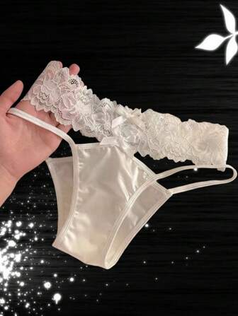 Sexiga underkläder ihåliga genomskinliga spetsar Spets Sexiga underkläder Triangelbyxor för kvinnor Kors frestelse Dubbel rosett Sexiga flickunderkläder Modeunderkläder Grenficka Design för att installera leksaker