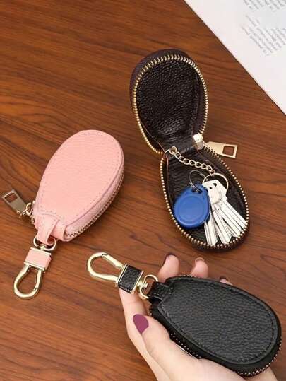 1 Stück tragbare elliptische Schlüsseltasche, Schlüsselanhänger mit hoher Kapazität Multi-Funktions Universal Schlüsseltasche mit General Motors Gürtelschnalle für Herren und Damen, Autoschlüsselanhänger, Rückkehrer Geschenk-Schlüsselanhänger