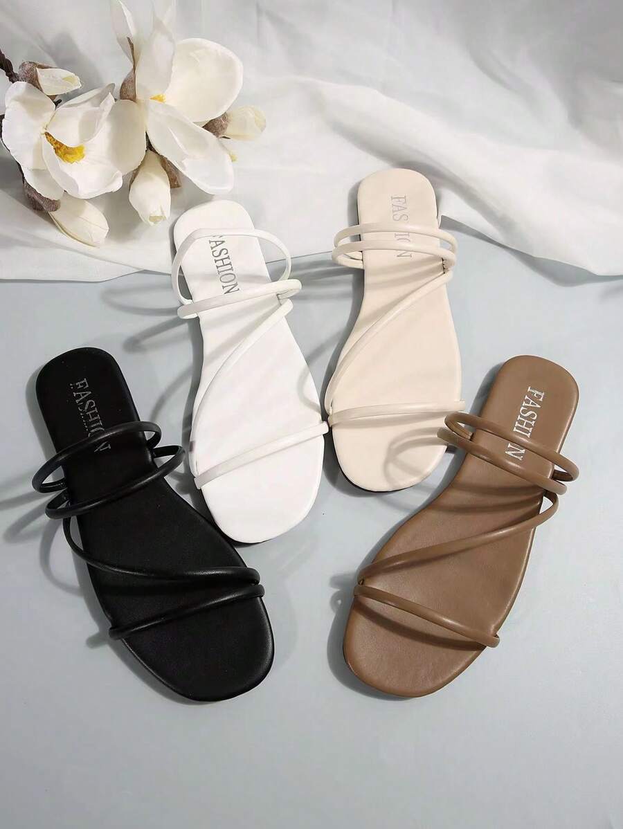 Dép nữ thời trang - Nhẹ, thoáng khí, hở mũi, đế bằng, dép xăng đan mùa hè thoải mái với đế trong êm ái và quai điều chỉnh được để dễ dàng mang vào, phù hợp với trang phục đi biển.