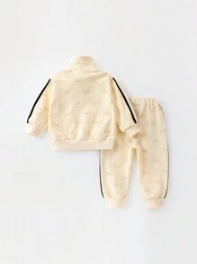 2 件套年轻女孩运动蝴蝶结印花长袖拉链夹克和长裤套装，秋季/春季