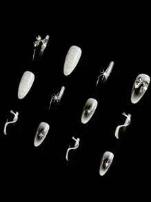 立即升级您的外观与 24 件街头简约休闲日常 Y2K 摇滚哥特黑、白、银系列 3D 金属蝴蝶结黑白光晕染色银色流体金属图案八角星光 3D 星星装饰水钻装饰中号杏仁假指甲套装，按压指甲，适合具有酷炫帅气个性的女性和女孩，音乐节必备美甲用品指甲 - 黑與白 - 查看 5