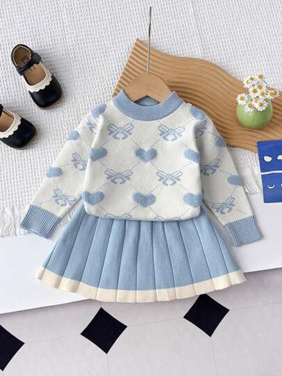 年轻女孩的极简主义心形与蝴蝶结针织毛衣 + 裙子套装，秋冬