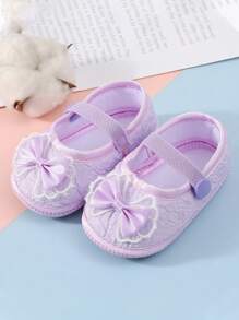1 đôi giày trẻ sơ sinh chống trượt thích hợp cho trẻ mới biết đi trong nhà, giày đế bằng mềm mại có thiết kế nơ dễ thương. - Màu tím - Xem 1
