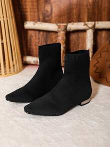 Black Sock-Covered Mid-Calf Boots With Small Square Toe And Flat Heels. Comfortable And Lightweight For Daily Wear. Fashionable And