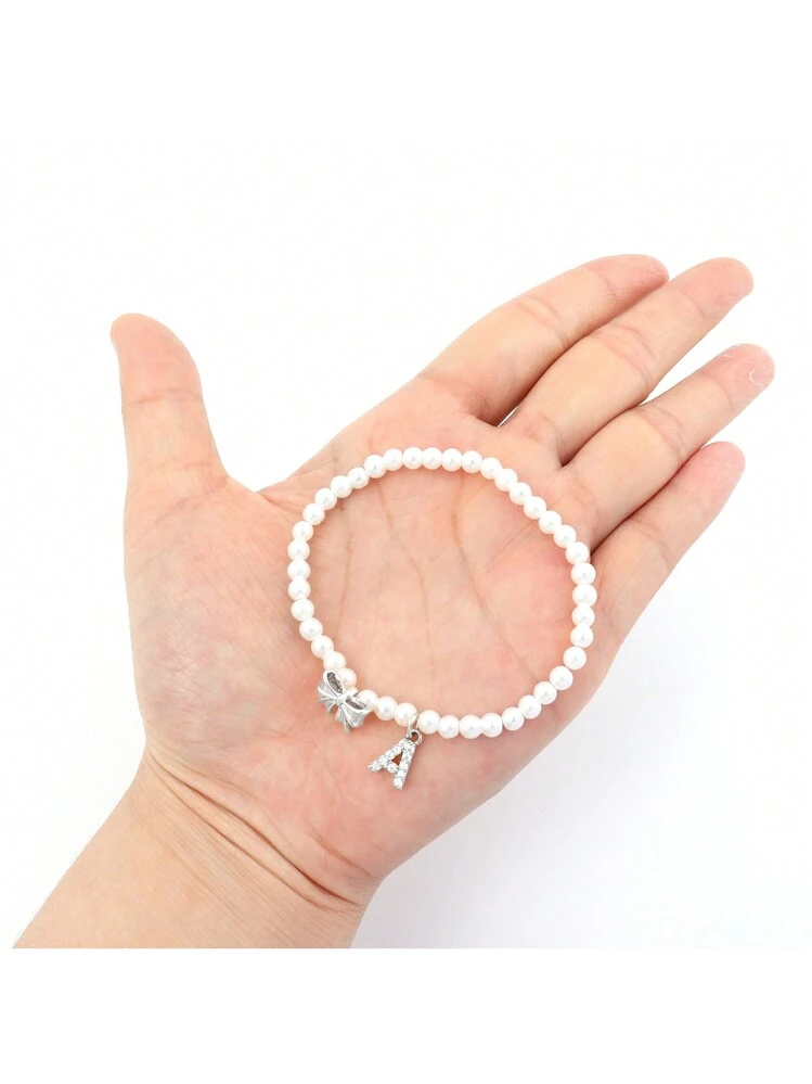Collana con ciondolo fiocco in pizzo e perline - Gioielli - Collane