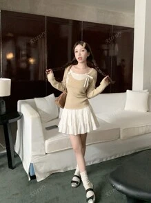 RUIWY Women's Sweet Bowknot Designed Colorblock Long Sleeved Slim Fitted Sweater Round Neck Pullover Top For Autumn