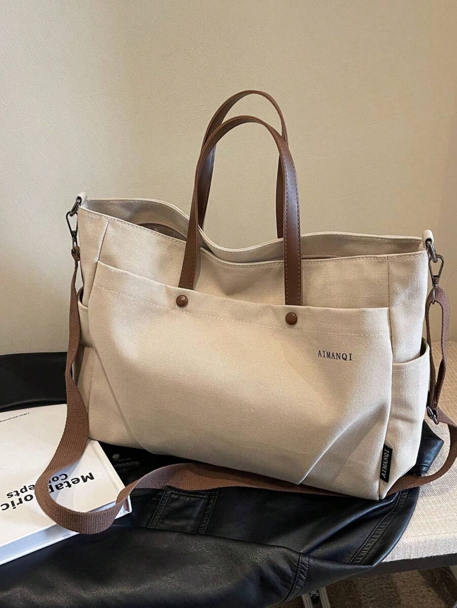 休闲简约风格，可调节肩带，大容量单肩包/斜挎包/日常包。适合日常使用——是旅行、工作、购物、上学、通勤、上学等场合的理想之选。适合女性、年轻职业女性、上班族、大学生、年轻女孩以及文艺青年或学生。可装书籍、购物物品，是返校必备单品。