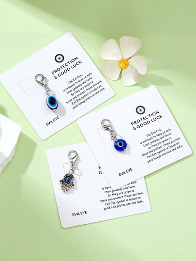 1 Stück Zinklegierung Böser Blick Anhänger mit Karte, mysteriöser Böser Blick Charm, Glücksbringer Schlüsselanhänger für Rucksack, Handtasche, Geldbörse, Schlüssel, einzigartige Farbkombination und Design als Geschenk für Freunde, Halloween Auto Accessoires, Taschenbaumler, Schule, süßer Goth Y2k