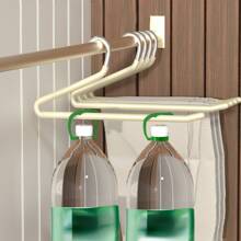 现代简约黑色和米色天鹅形裤子衣架，带防滑涂层，用于整理衣物