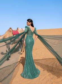 Faeriesty Đầm dạ hội trang trọng thanh lịch dành cho nữ với cổ chữ V sâu, tay áo dài chấm đất trong suốt ấn tượng và kiểu dáng đuôi cá tôn dáng. Được thiết kế cho các buổi dạ tiệc trang trọng, lễ trao giải, sự kiện từ thiện quan trọng, tiệc cưới và các buổi tiệc chiêu đãi sang trọng. - Màu xanh lá cây đậm - Xem 3