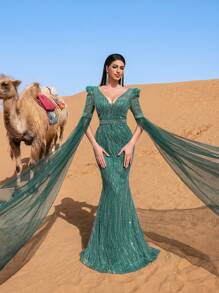 Faeriesty Đầm dạ hội trang trọng thanh lịch dành cho nữ với cổ chữ V sâu, tay áo dài chấm đất trong suốt ấn tượng và kiểu dáng đuôi cá tôn dáng. Được thiết kế cho các buổi dạ tiệc trang trọng, lễ trao giải, sự kiện từ thiện quan trọng, tiệc cưới và các buổi tiệc chiêu đãi sang trọng. - Màu xanh lá cây đậm - Xem 4