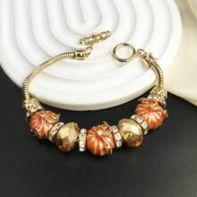 1 szt. Urocza emaliowana, słodka pomarańczowa dynia z kryształkami bransoletka z koralików dla kobiet na Halloween, dekoracyjna bransoletka z akcesoriami do biżuterii - Pomarańczowy - Zobacz 8