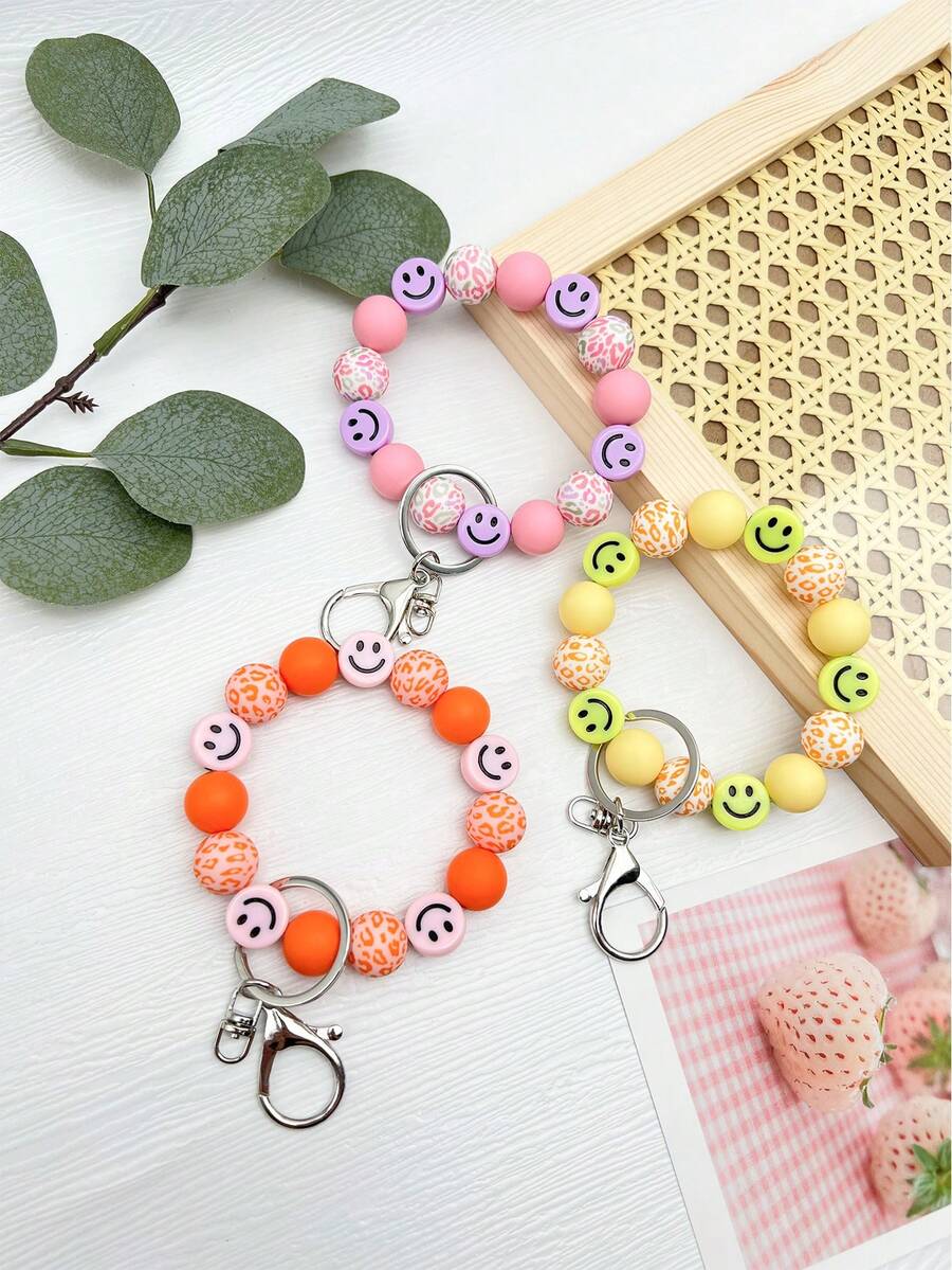 1 chiếc móc khóa đeo tay hình mặt cười bằng silicon họa tiết da báo, túi xách, quà tặng móc chìa khóa ô tô - Nhiều màu - Xem 1