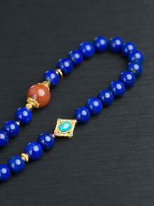 VE [VE] 1 pièce de collier de perles de lapis-lazuli naturel de haute qualité en argent, décoré de cornaline et de turquoise. Chaque pierre présente une apparence majestueuse comme le ciel nocturne, symbolisant la sagesse et la sérénité. Le port de ce collier ajoute non seulement une touche de mystère, mais inspire également la paix intérieure et la force, mettant en valeur votre charme et votre goût uniques. Les couleurs des pierres précieuses naturelles sont sélectionnées de manière aléatoire.