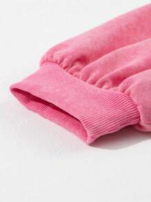 Sweatshirt à manches tombantes avec demi-boutons, nœud papillon et séquins