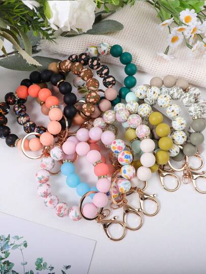 1 قطعة سوار أنيق مزين بالزهور والراين والخرز السيليكوني، سلسلة مفاتيح، سلسلة مفاتيح للحقيبة الظهر، خاتم مفاتيح السيارة، هدية صغيرة للأصدقاء، إكسسوارات السيارة في عيد الهالوين، تميمة للحقيبة، لانياردات للمدرسة بحامل بطاقة هوية، إكسسوارات السيارة، تميمة للحقيبة، أكسسوارات عيد الميلاد