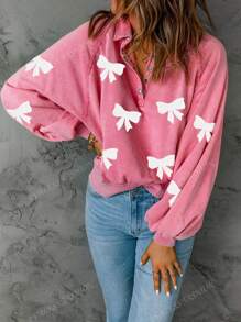 Sweatshirt à manches tombantes avec demi-boutons, nœud papillon et séquins