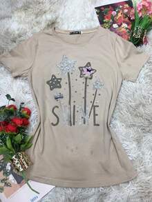 Camiseta com strass em forma de estrelas. Único 36 ao 44