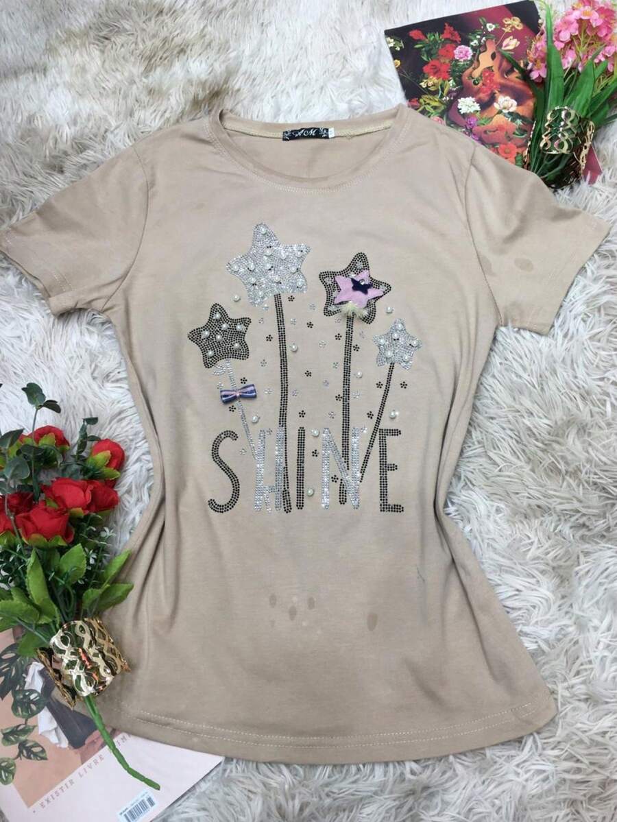 Camiseta com strass em forma de estrelas. Único 36 ao 44