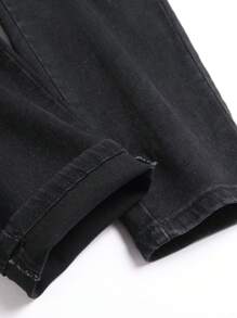 Jeans negros lavados de corte skinny y elástico de unicolor para hombre