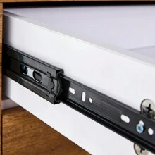 Double-Drawer Bedside Table. The Board Surface Is MDF Sticker, And Both Sides Are Transparent Tempered Glass. The Design Is Simple And Elegant, With Excellent Storage Functions.