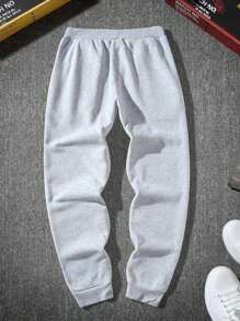 青少年男孩印花休闲运动裤、街头服饰、图案运动裤