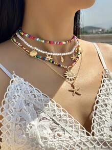 Un nuevo conjunto de 5 collares, 7 pulseras y 7 tobillos con cuentas de conchas y estilo bohemio de vacaciones, con colgantes de estrella de mar y combinación de cuentas de arcilla polimérica, adecuado para el uso diario de la mujer