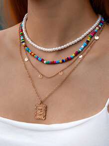 Un nuevo conjunto de 5 collares, 7 pulseras y 7 tobillos con cuentas de conchas y estilo bohemio de vacaciones, con colgantes de estrella de mar y combinación de cuentas de arcilla polimérica, adecuado para el uso diario de la mujer