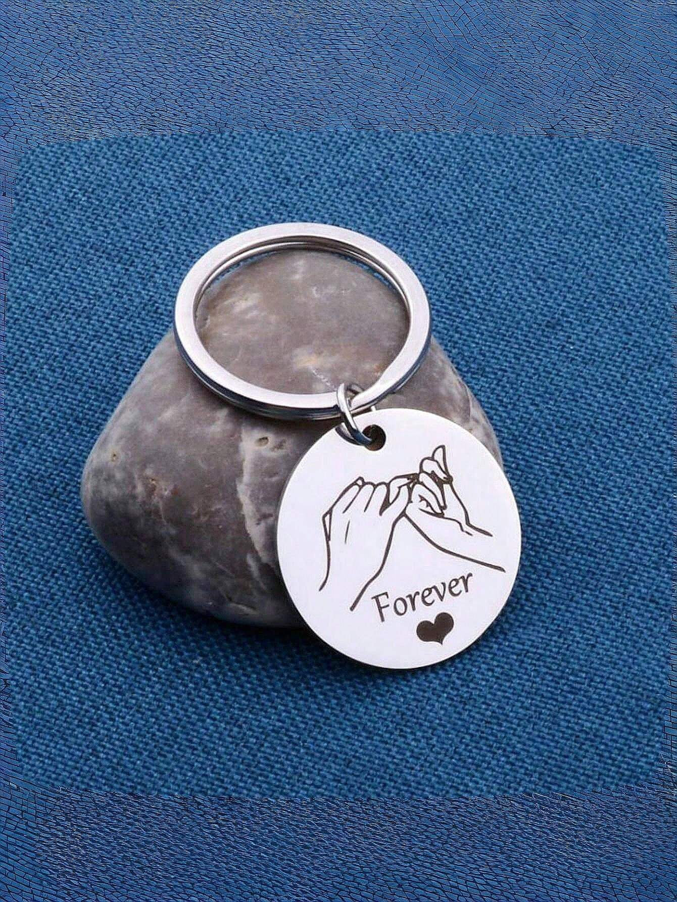 A Engraved Nameplate With Couple Elements Engraved With A Hand In Hand