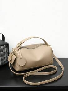 1 件纯色简约大容量多口袋斜跨手提包，适合女性日常使用手提包