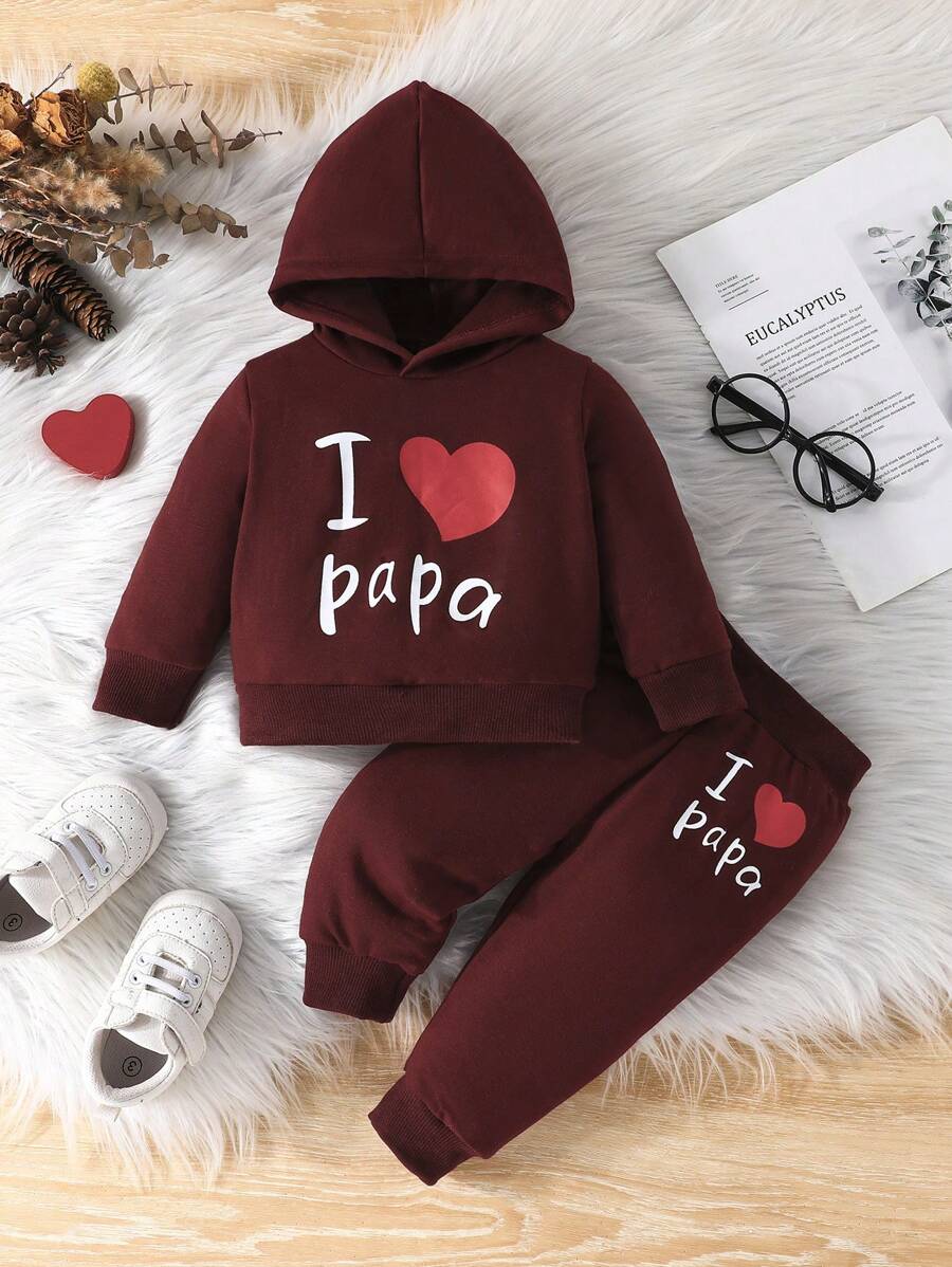 Bộ 2 món đồ chơi trẻ em: Áo hoodie dài tay và quần dài họa tiết trái tim, thích hợp cho mùa xuân/thu.