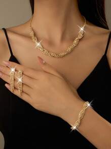三件套：一条镶钻项链、一副流苏耳环和一条手链。适合日常佩戴，也适合派对、婚礼和其他场合。 - 金色 - 查看 1